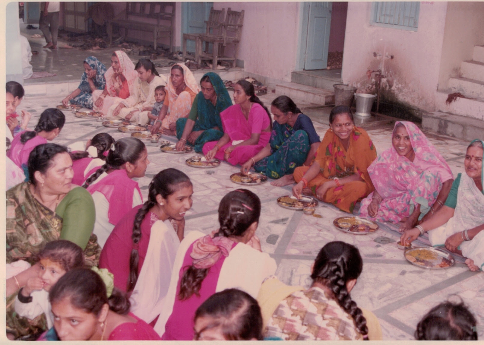 Women gathered together sharing a meal